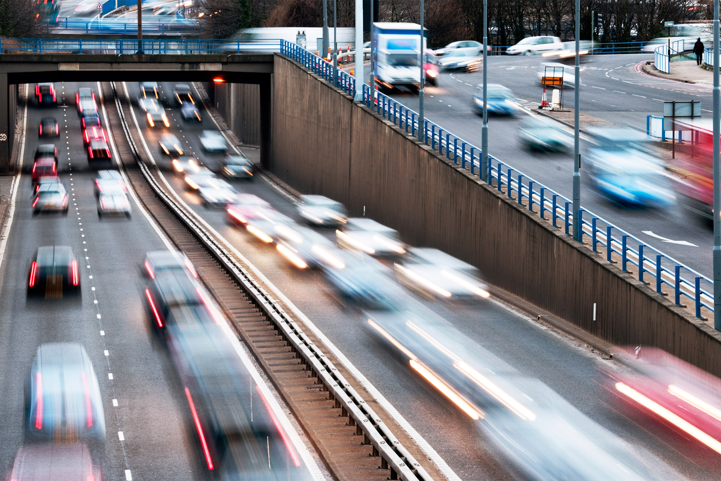 Speeding vehicles on a highway.