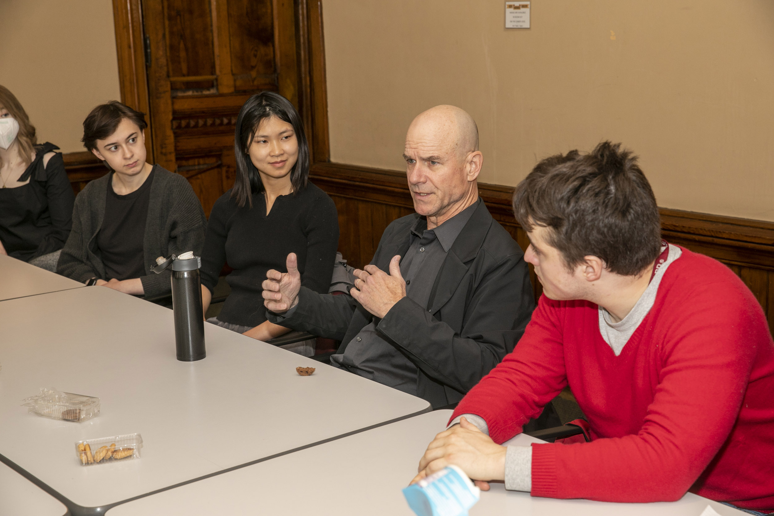 Salon members with Professor James Robson speaking.