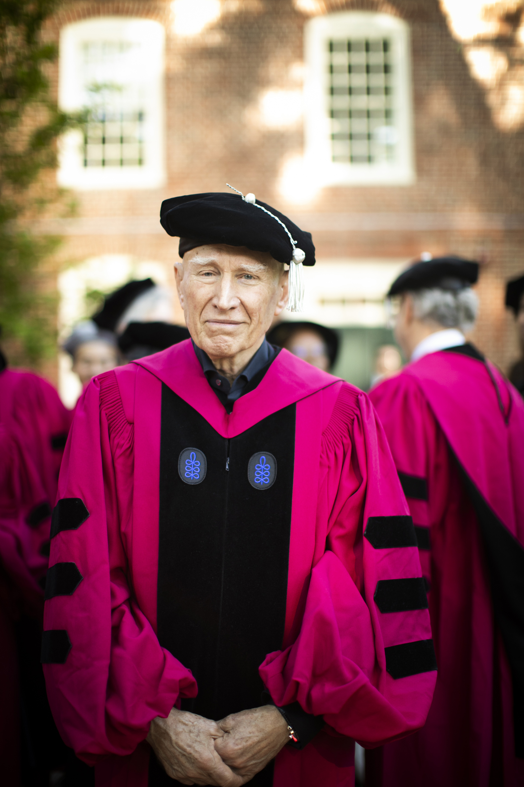 Honorary degree recipient Sebastiao Salgado is pictured outside Massachusetts Hall.