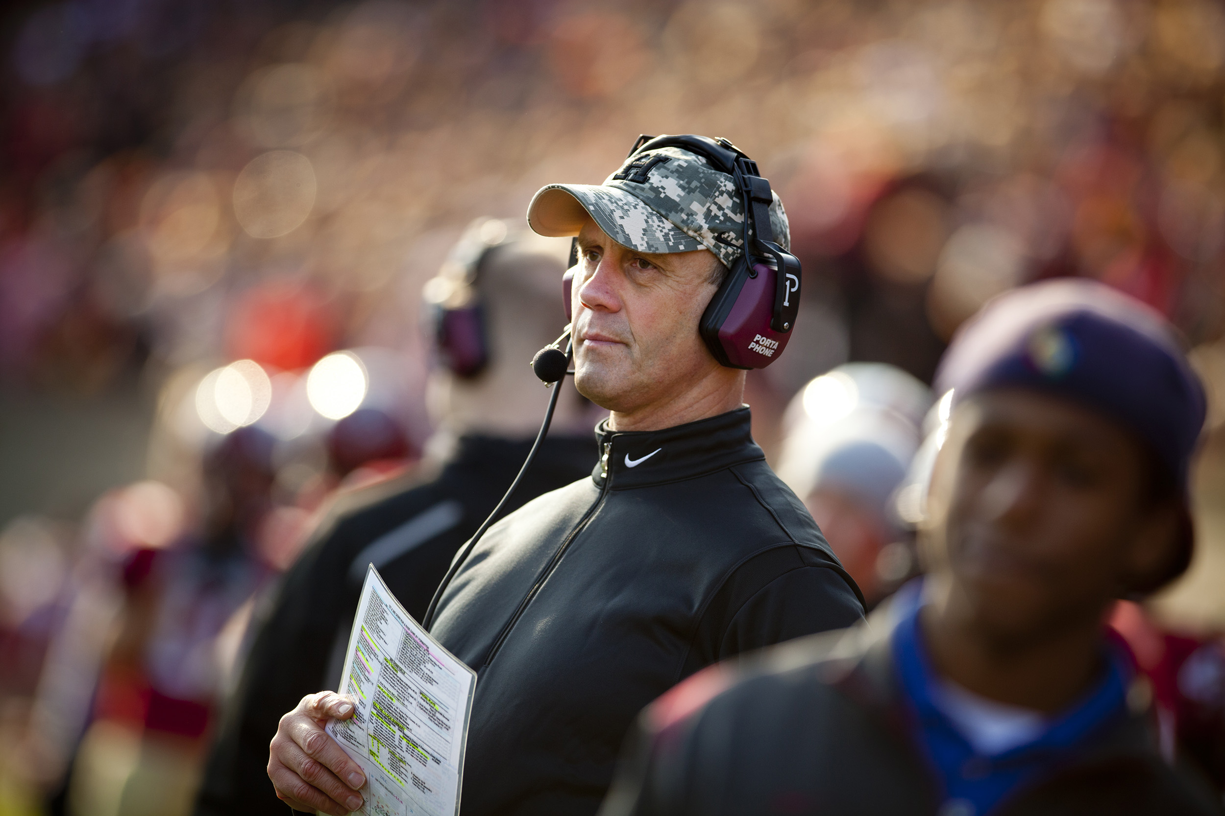 Head coach Tim Murphy on sidelines at Harvard Stadium during 2010 game vs Yale.