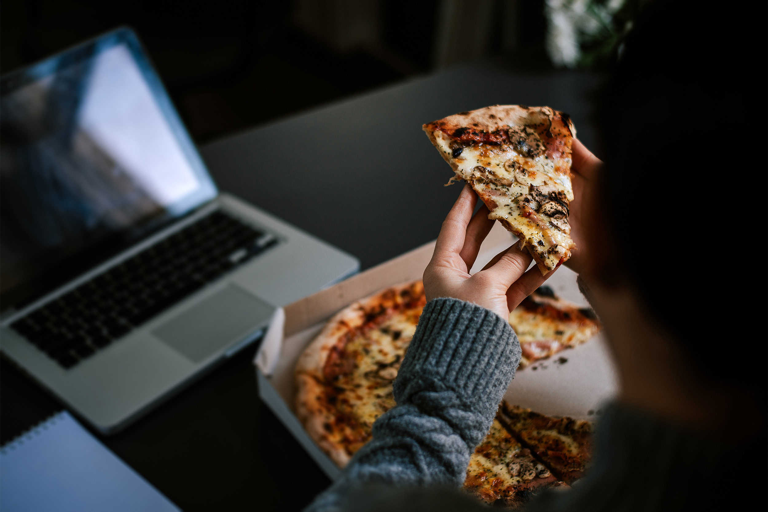 Eating pizza late at night.