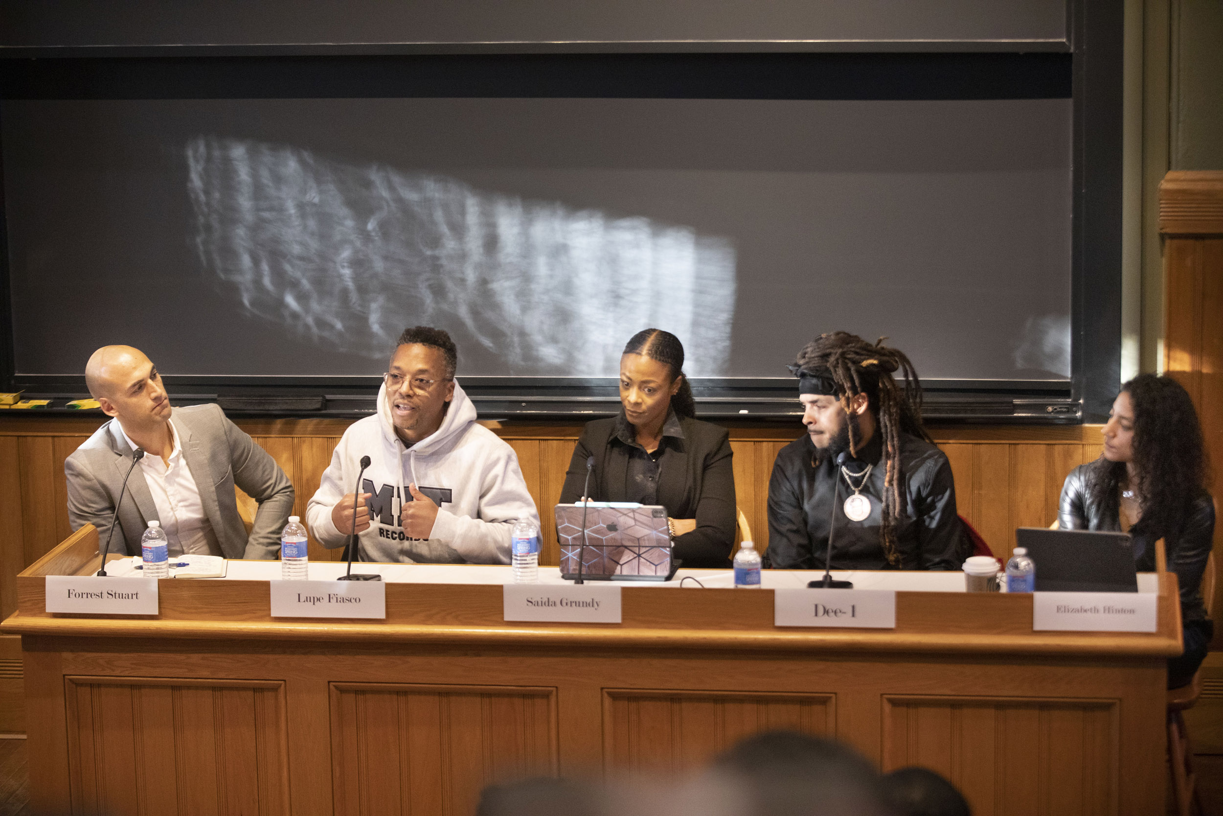 Panelists Forrest Stuart, Lupe Fiasco, Saida Grundy, Dee-1, and Elizabeth Hinton.