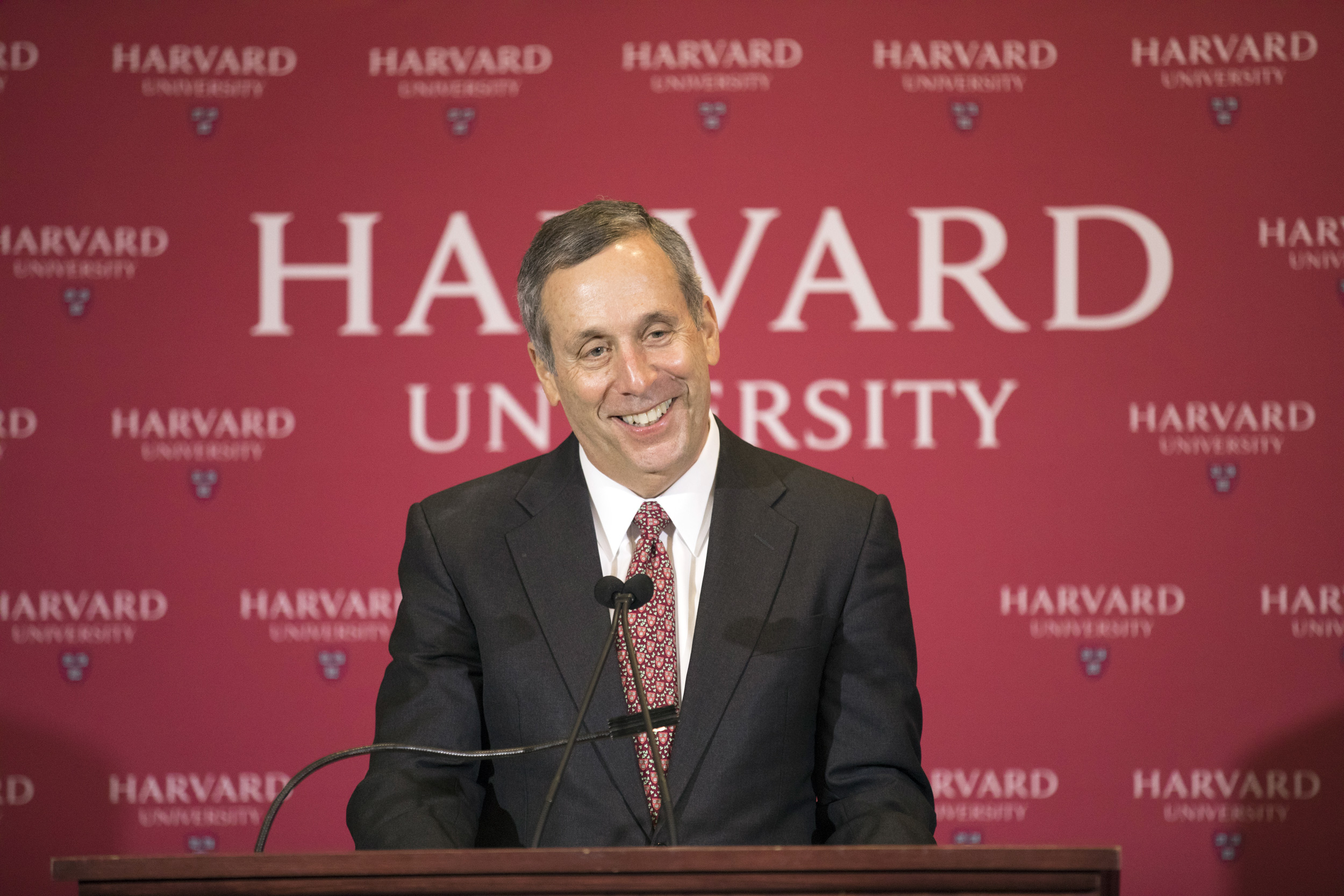 Larry Bacow is pictured at the podium in February 2018 after his selection as Harvard’s 29th president was announced at the Barker Center.