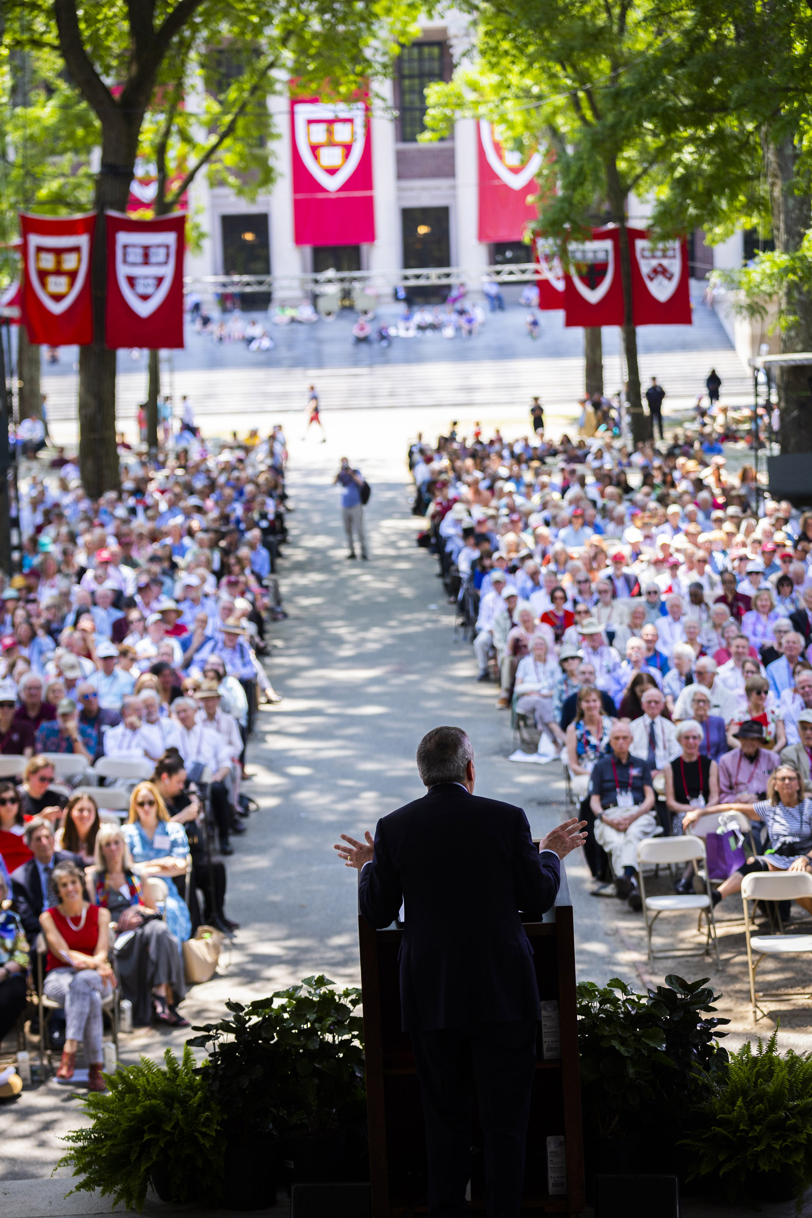 President Bacow addressing alums.