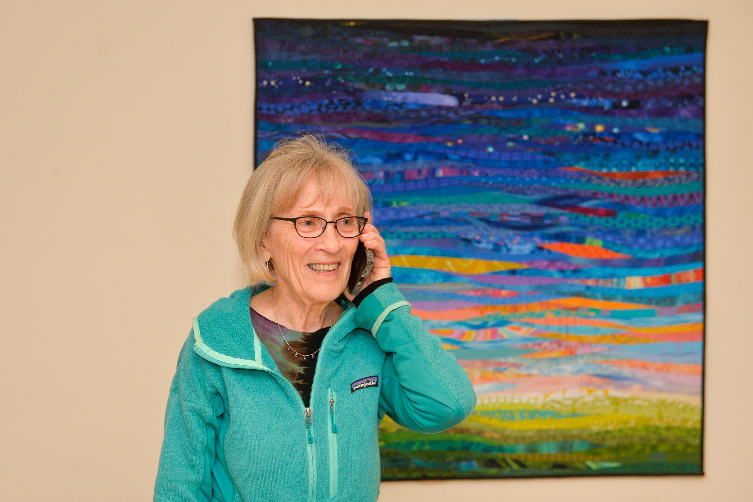 Professor Claudia Goldin in her home receiving congratulations after receiving news of winning the Sveriges Riksbank Prize in Economic Sciences.