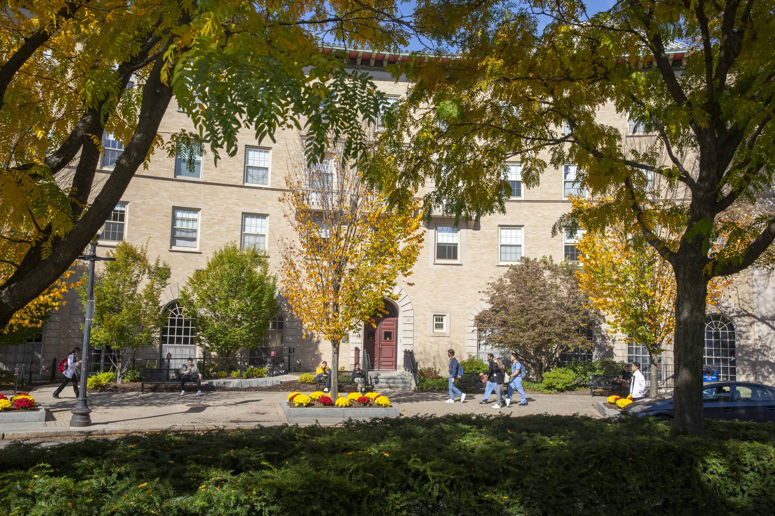 People walk past Vanderbilt Hall at the Medical School.