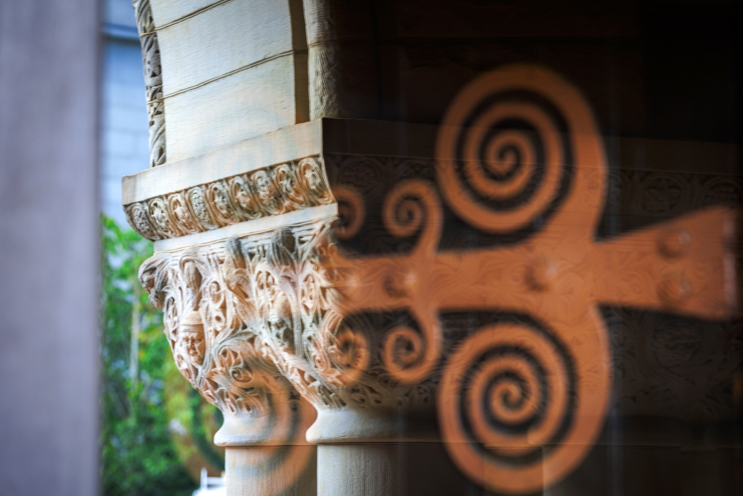 The columns of Austin Hall are reflected in the entrance to the building at Harvard Law School.