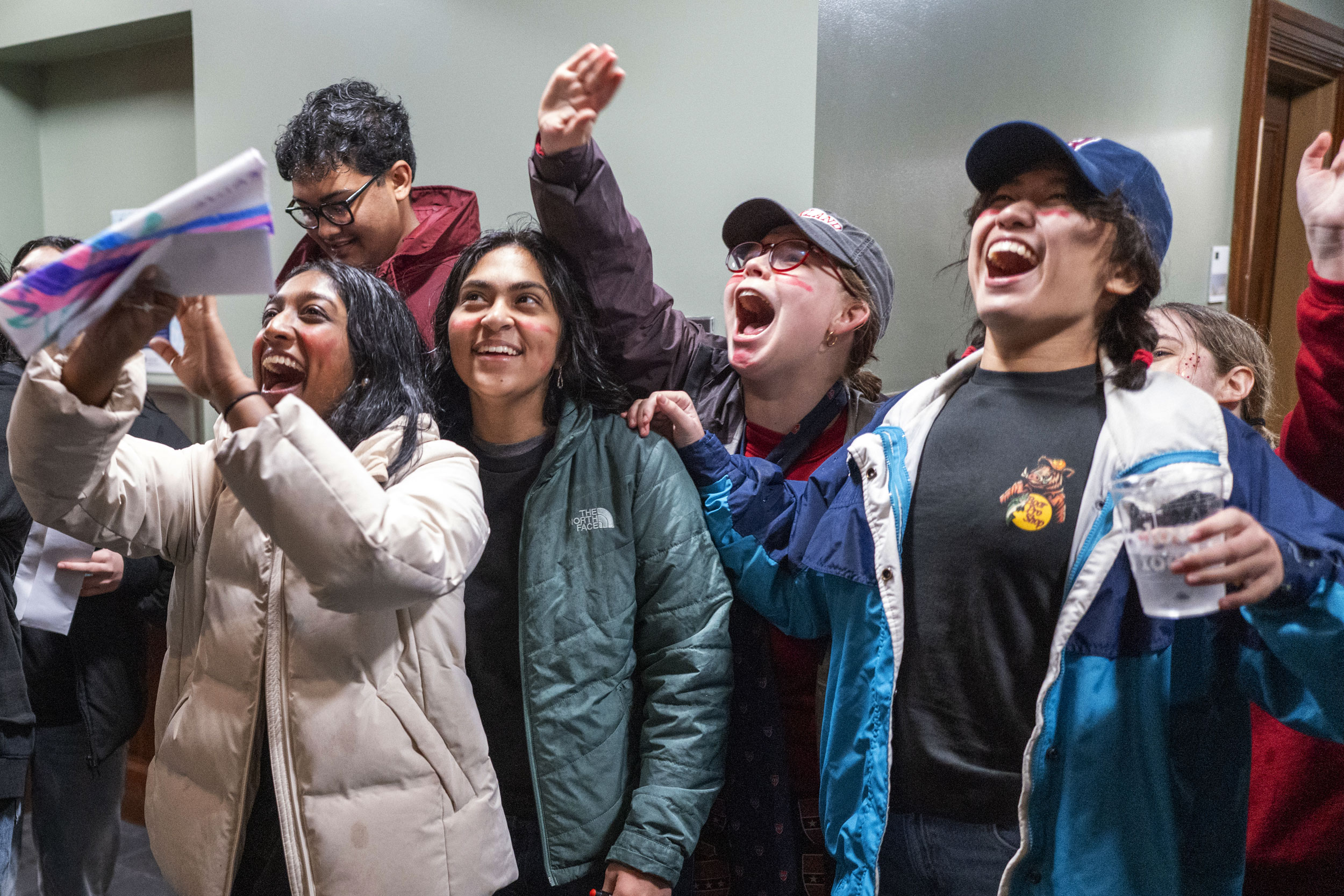 Members of Kirkland House greet friends from Adams House coming down the steps of Matthews Hall.