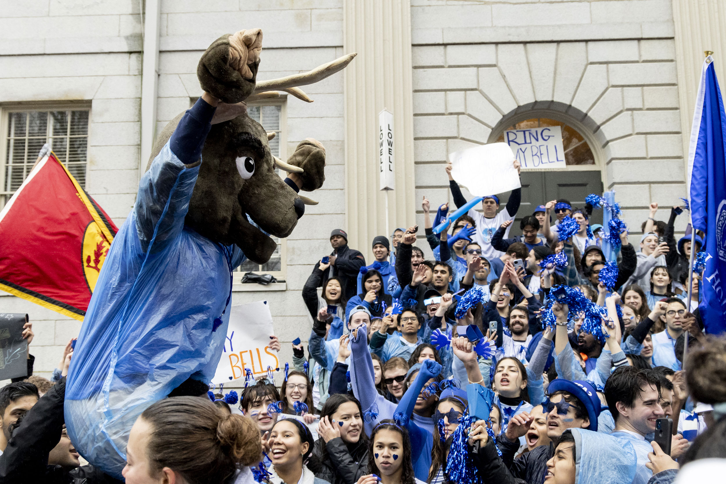 Lowell House students cheer for their house on the steps of University Hall.