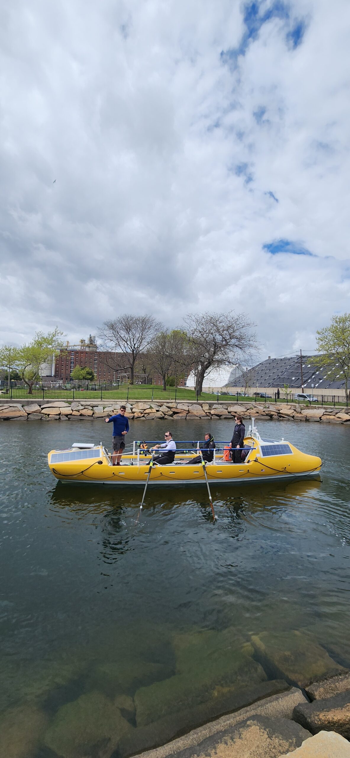 Captain Bryan Fuller, First Mate John Lowry, Elizabeth Gilmore, and Klara Papp Anstey on a boat.