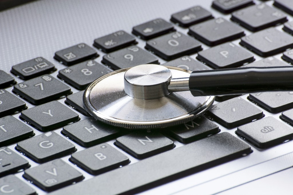 Stethoscope over a computer keyboard.