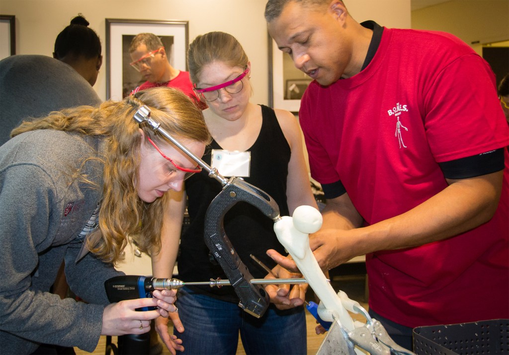 Blake Hauser (drilling) and Julia Gelissen practicing drilling and inserting intramedullary nail on sawbones model.