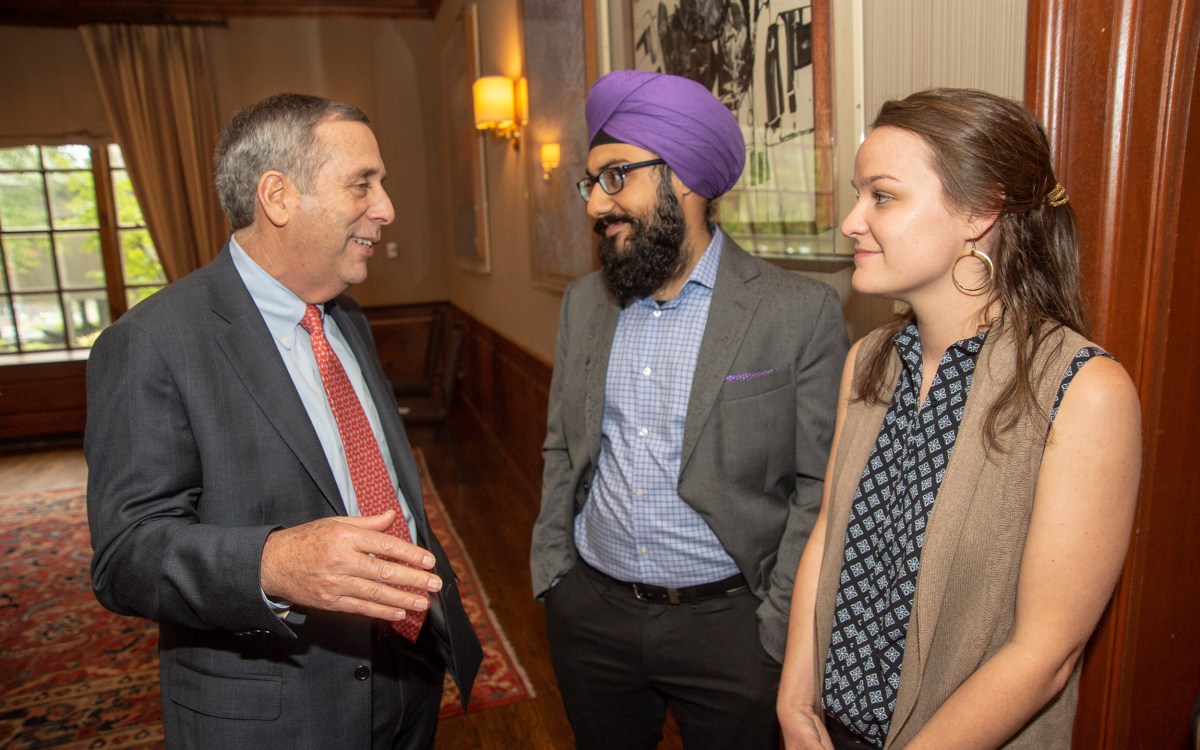 President Bacow, Harmann Singh (center), Sarah Bourland.