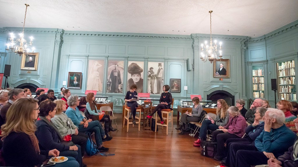 Speakers Anne Pender and Geraldine Brooks are sit flanked by audience at Houghton Library.