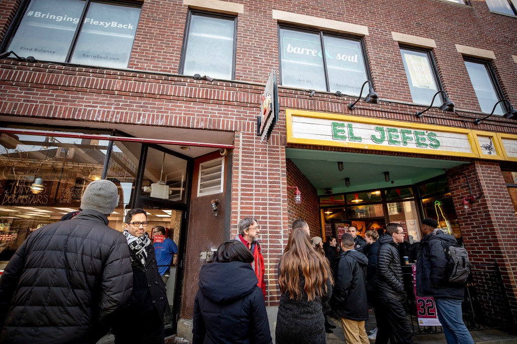 People in line in front of a Mexican restaurant