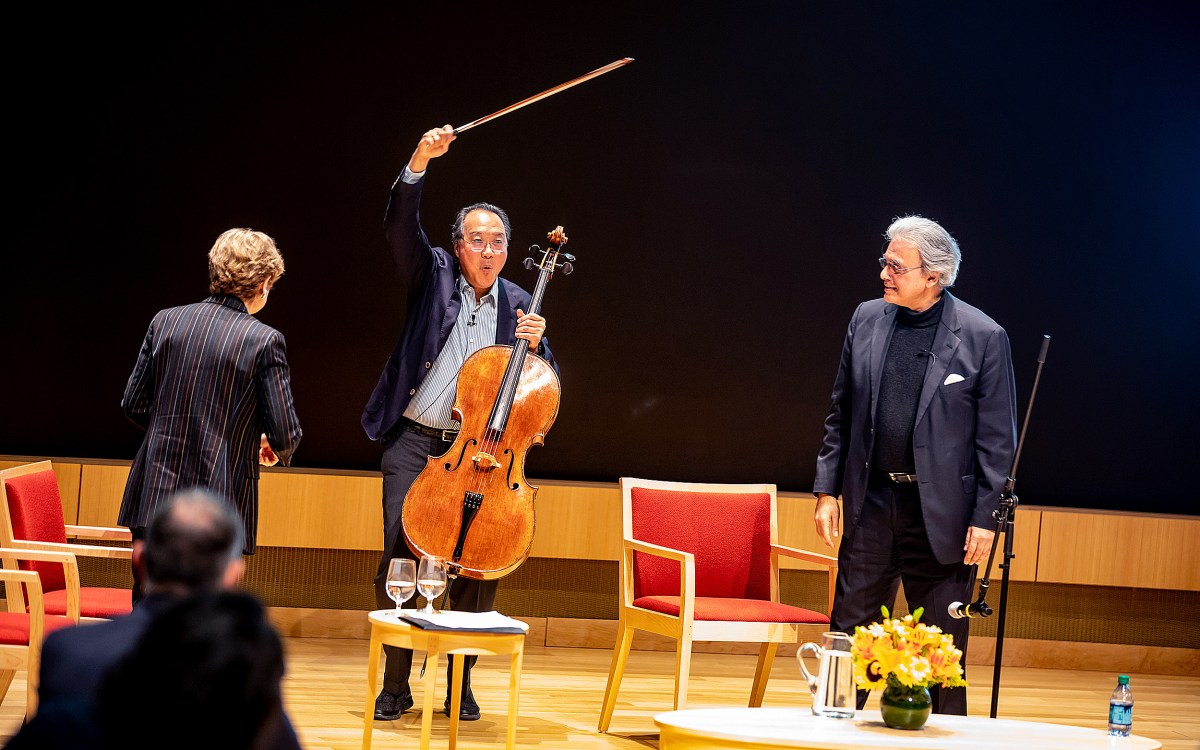 Yo-Yo Ma holds up a cello bow.