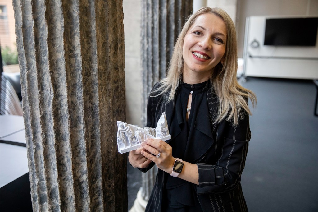 woman holding artifacts