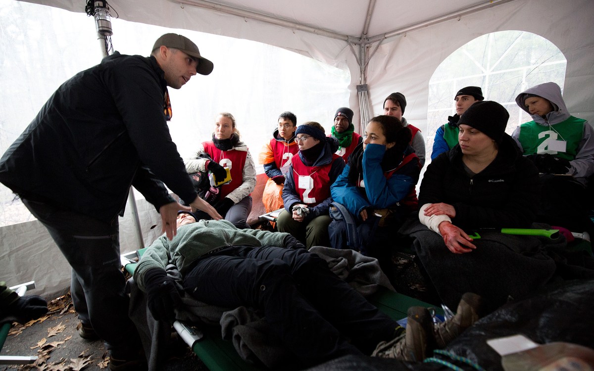 Participants learn to treat injuries in a humanitarian disaster simulation.