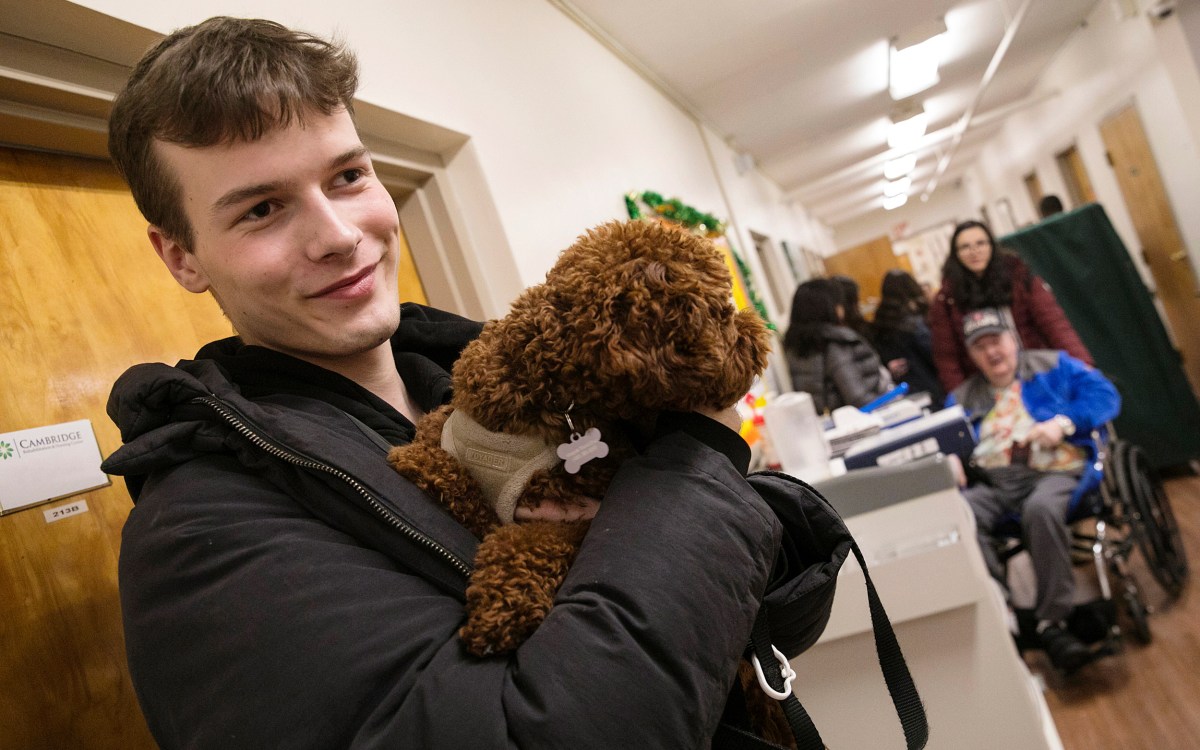 Man holding small dog