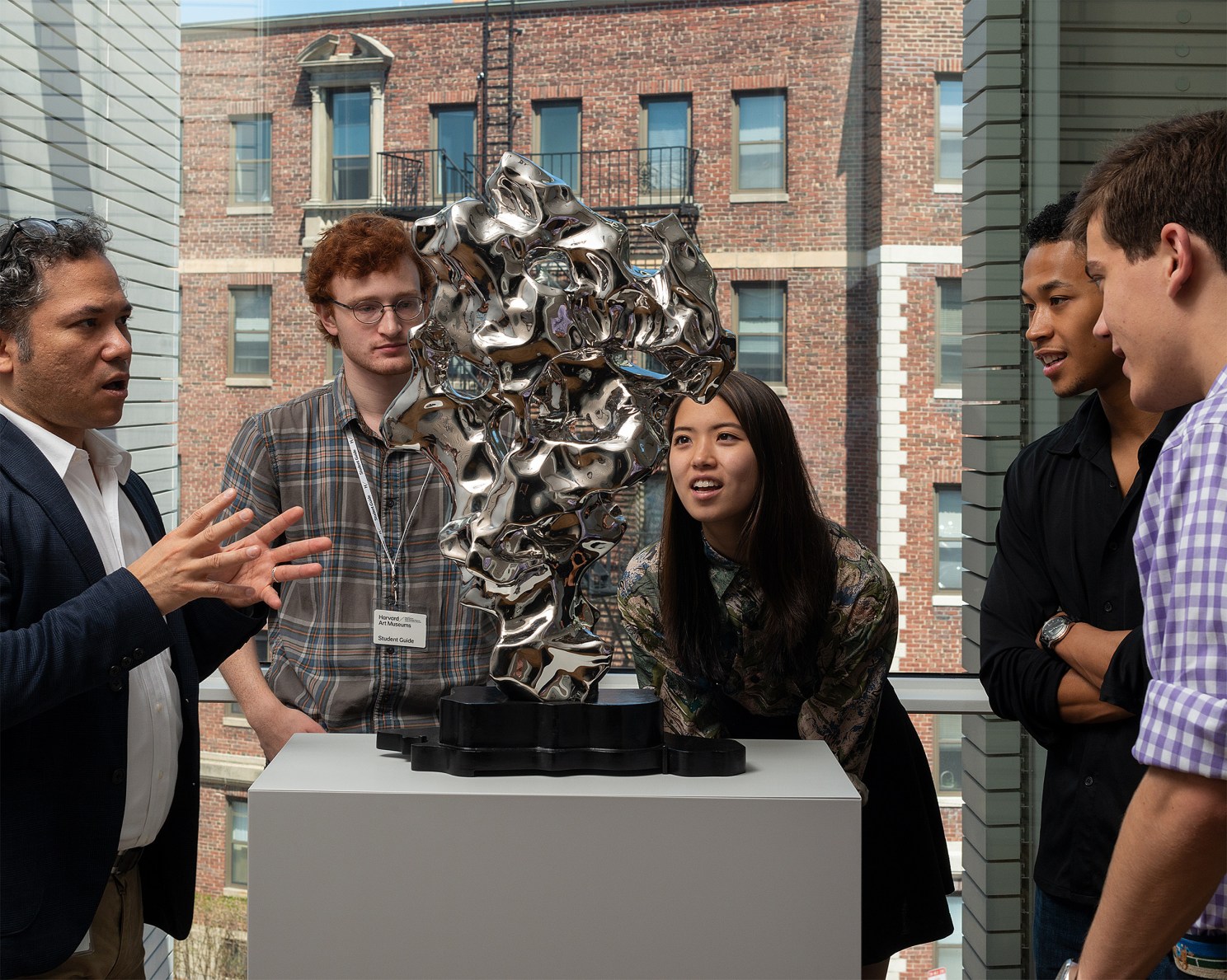 Student guides looking at an art piece