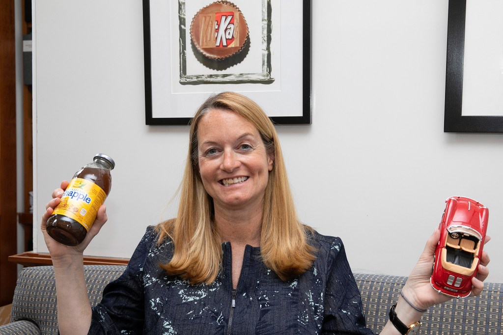 Jill Avery holds a toy car and a bottle of Snapple.