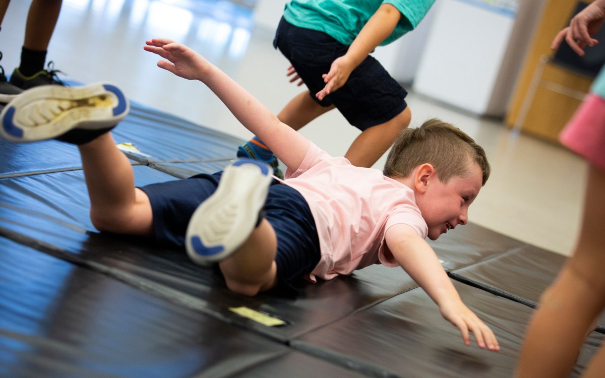 Luke Scanlon acts like an airplane during the American Repertory Theater workshop.