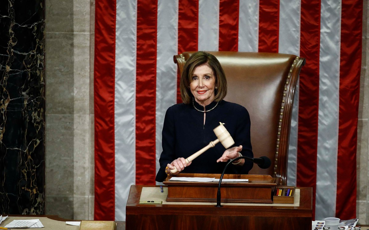 House Speaker Nancy Pelosi holds the gavel.