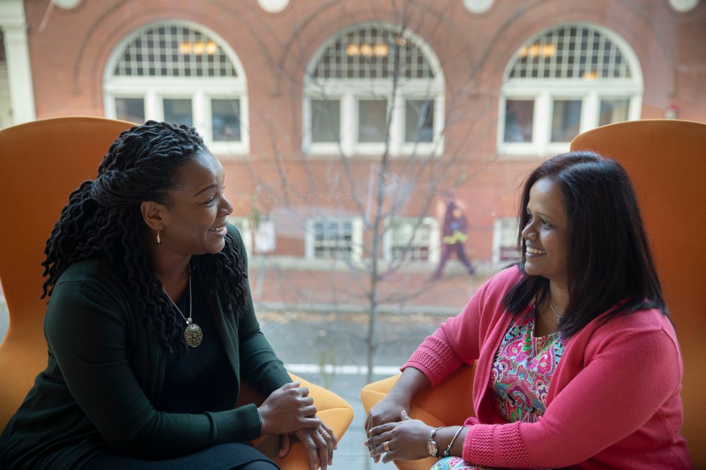 Mentor and mentee sitting together.