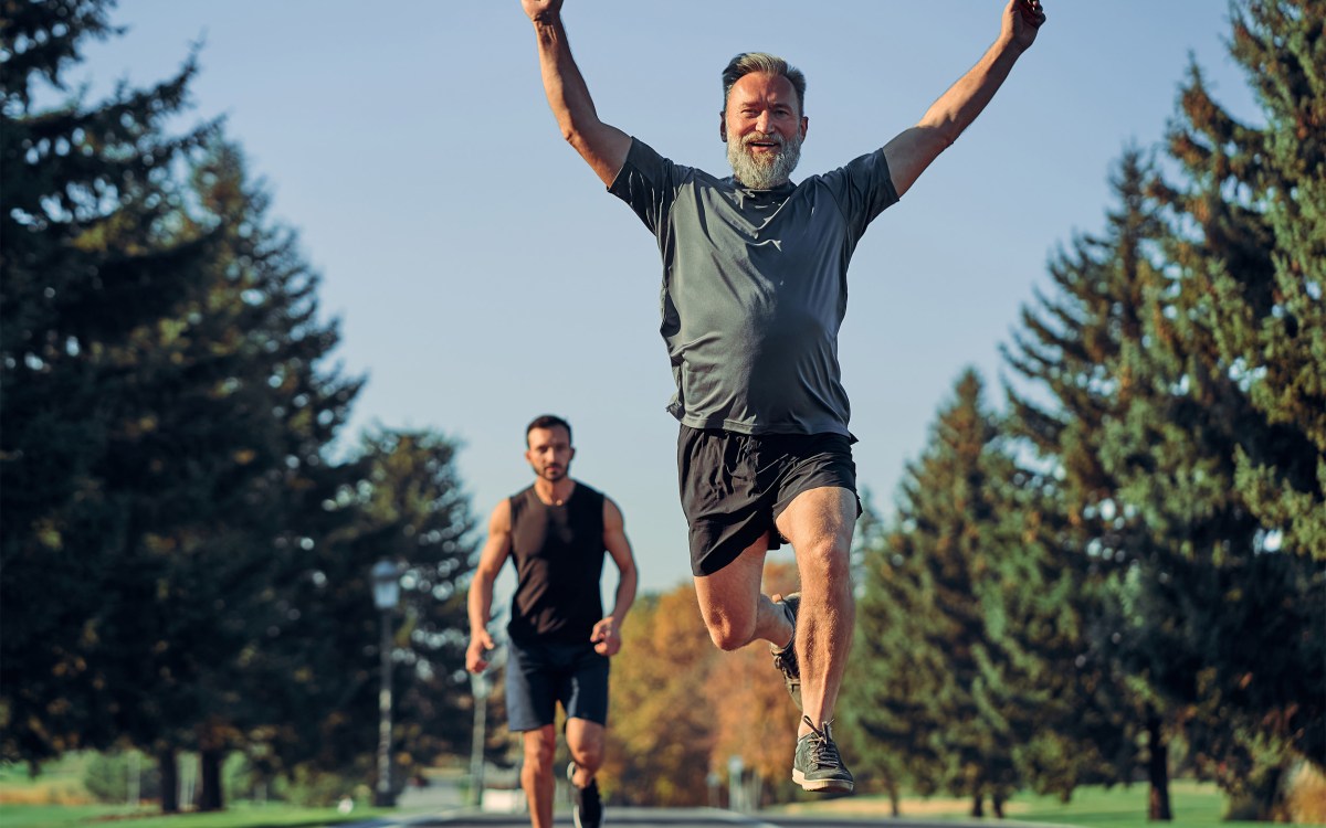 The old and young sportsmen running on the road.