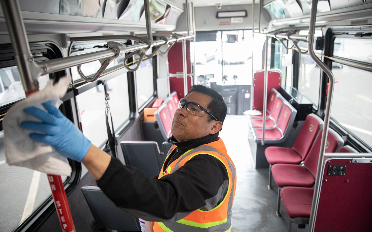 Cleaning a shuttle bus.