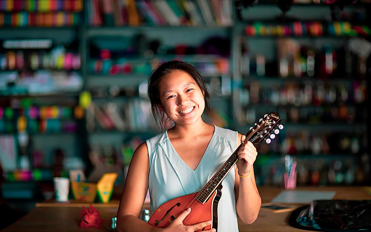 WHRB president Allison Pao ‘21, at the station with her mandolin.