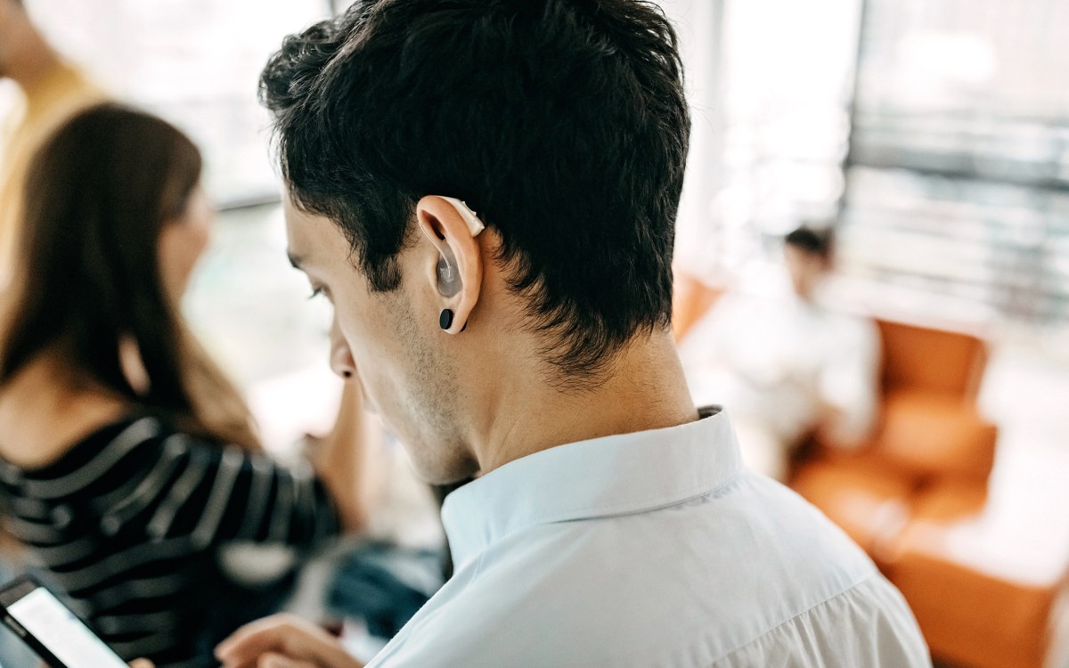 Person wearing hearing aid.