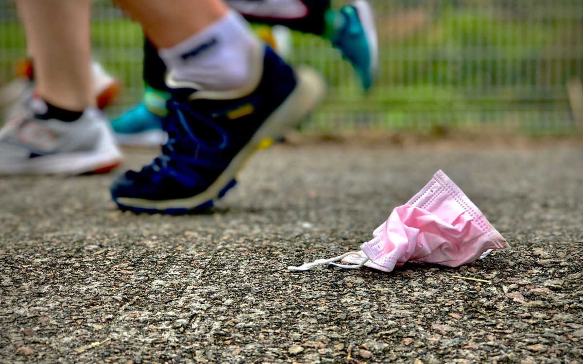 Runners and mask on ground.