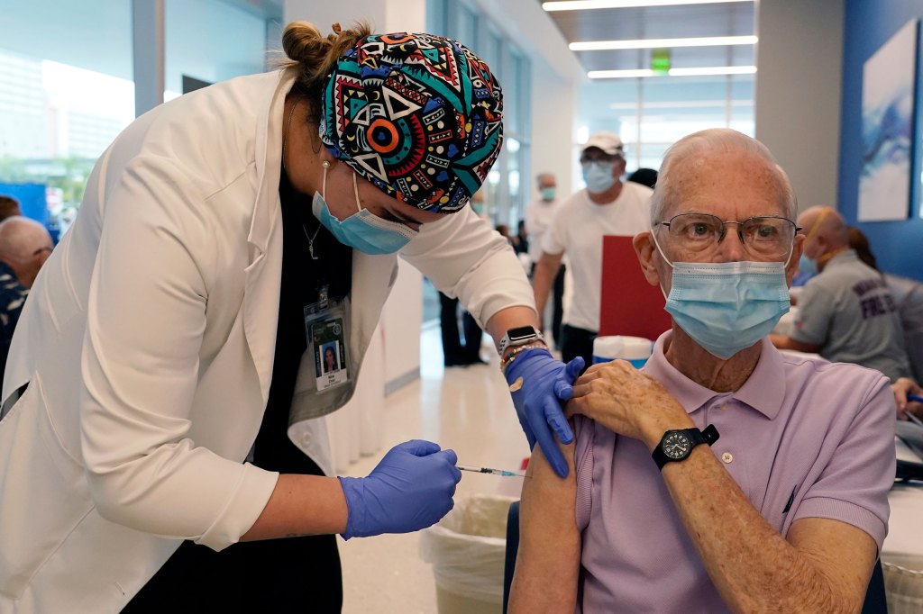 Senior citizen getting a vaccine.