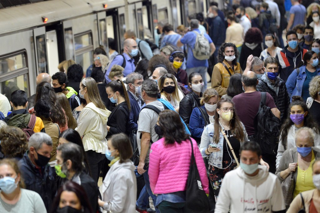 People in a crowd wearing masks.