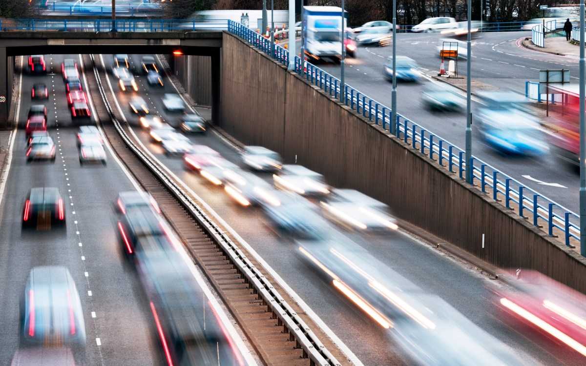 Speeding vehicles on a highway.