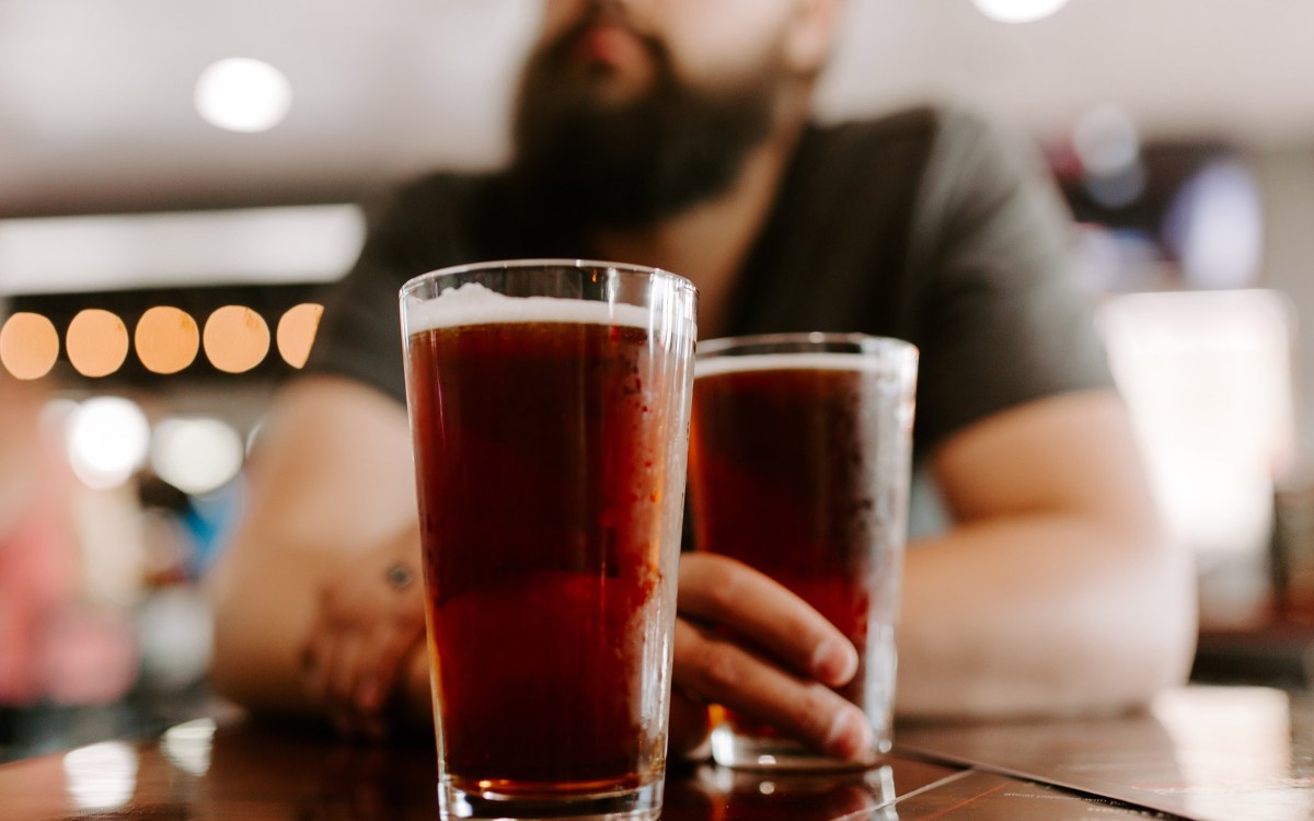 Man with two beers.