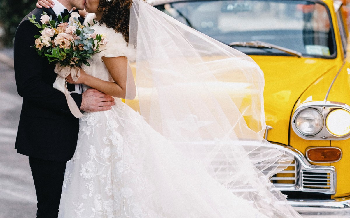 Ashley LaLonde and Noah Reimers kiss on their wedding day.