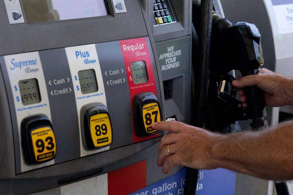 Motorist pumps gas.