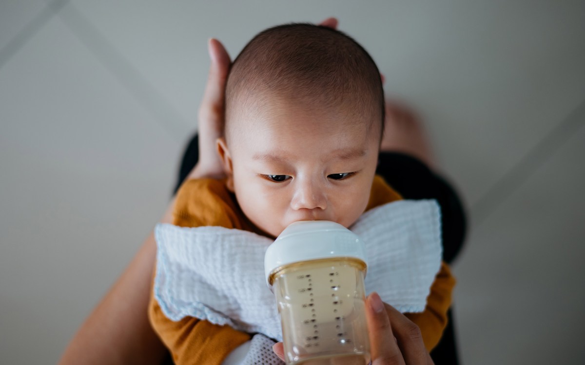 Mother feeding child.