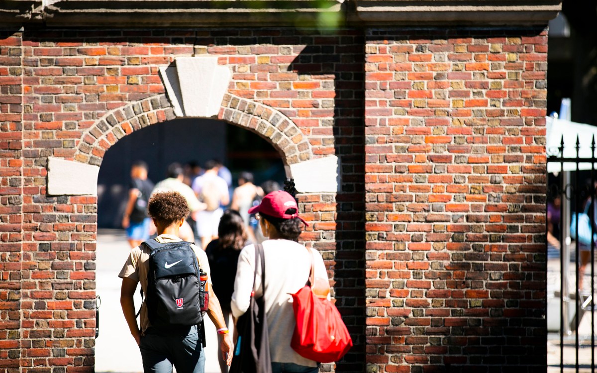 Students enter campus gate.
