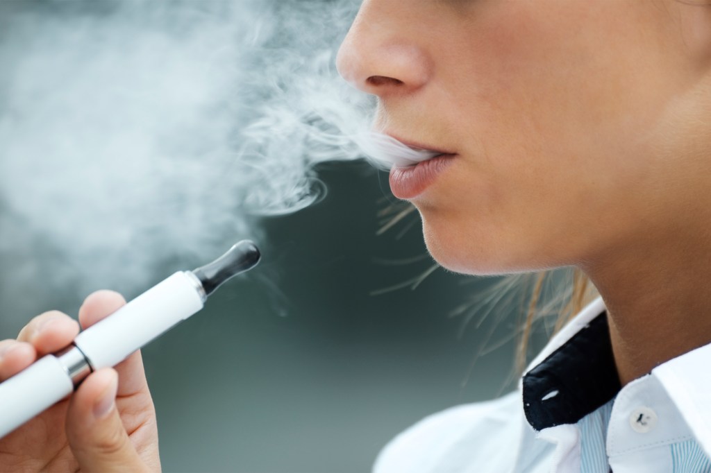 Woman smoking an e-cigarette