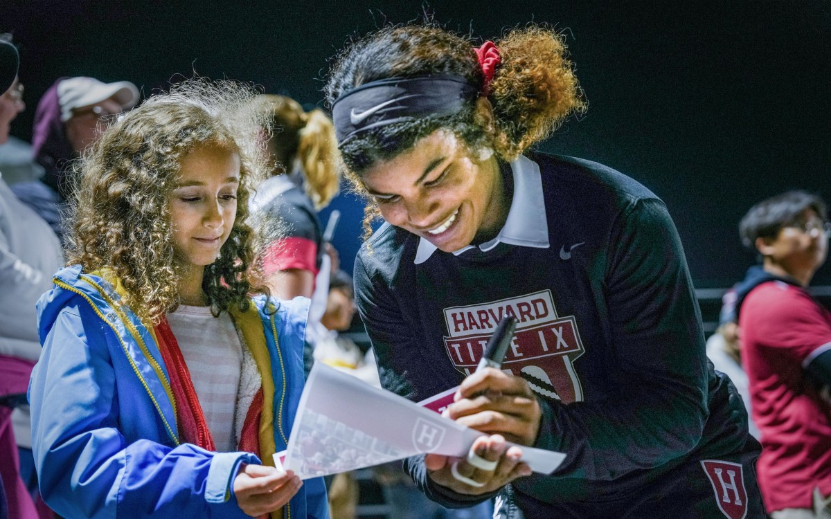 Lennox London ’26 signs autographs.