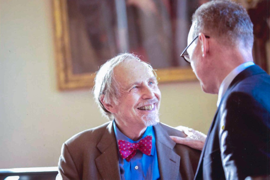 Paul Farmer (right) and Arthur Kleinman were photographed circa 2019 in the faculty room at Gordon Hall.