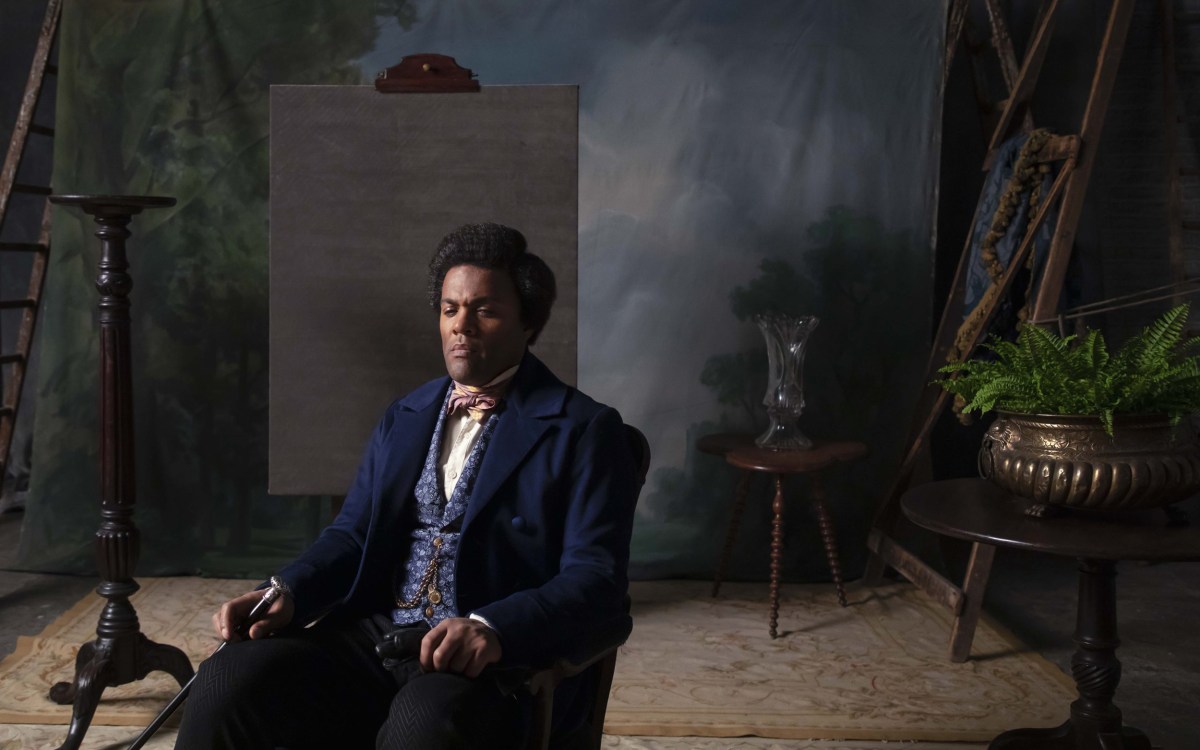 Frederick Douglass sits in photo studio chair in Isaac Julien's "Lessons of the Hour."