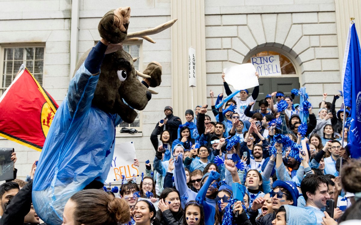 Lowell House students cheer for their house on the steps of University Hall.