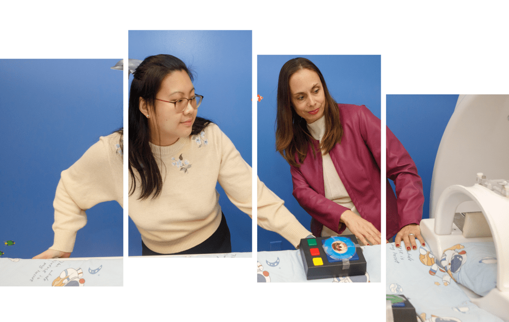 Megan Loh and Nadine Gaab show a model of an MRI machine they use to acclimate young study participants.