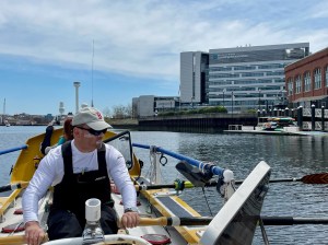 John Lowry sitting in a boat on the water.