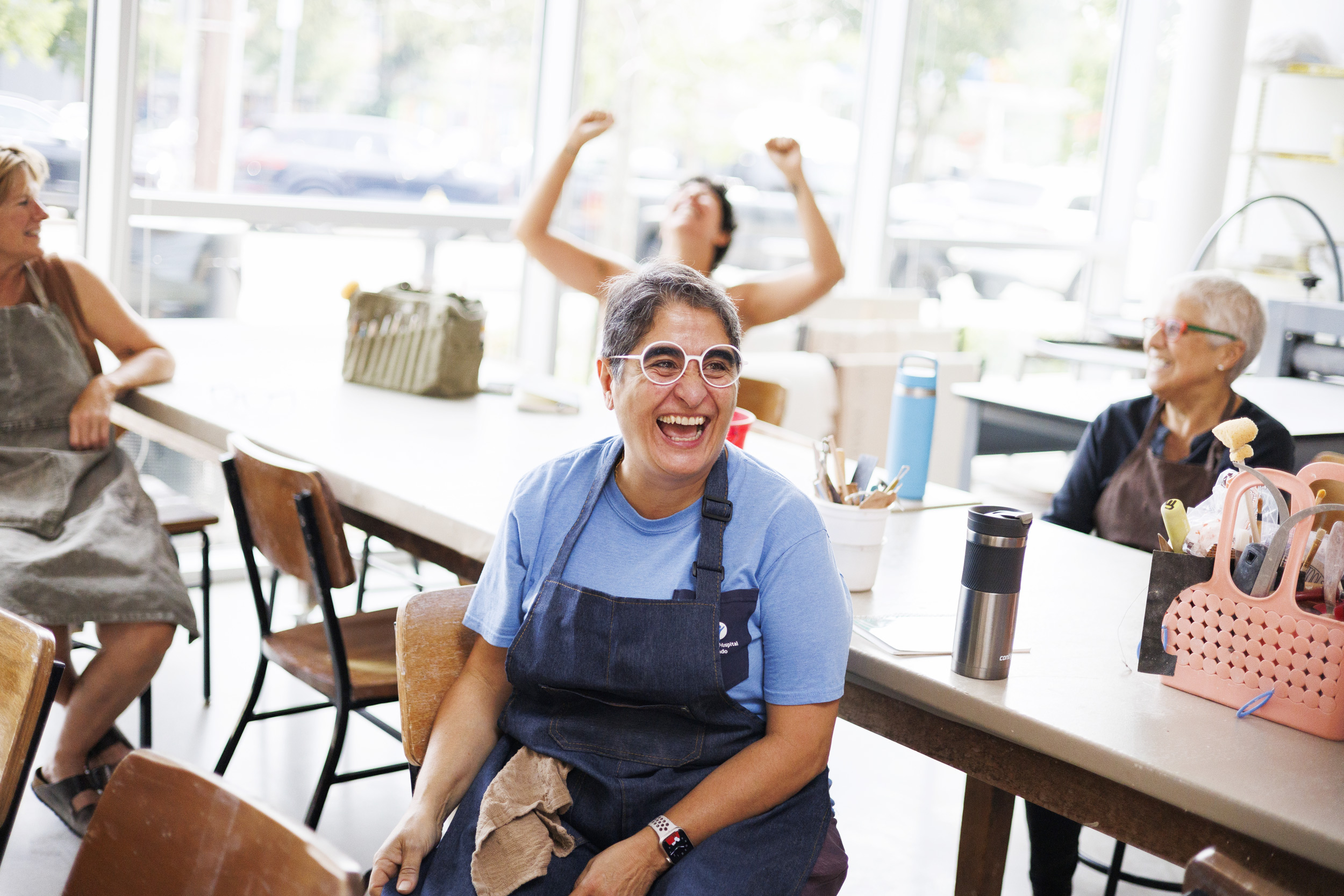 Suzanne Osorio and fellow students reacts after The Randomizer is spun at the Harvard Ceramics Program. 