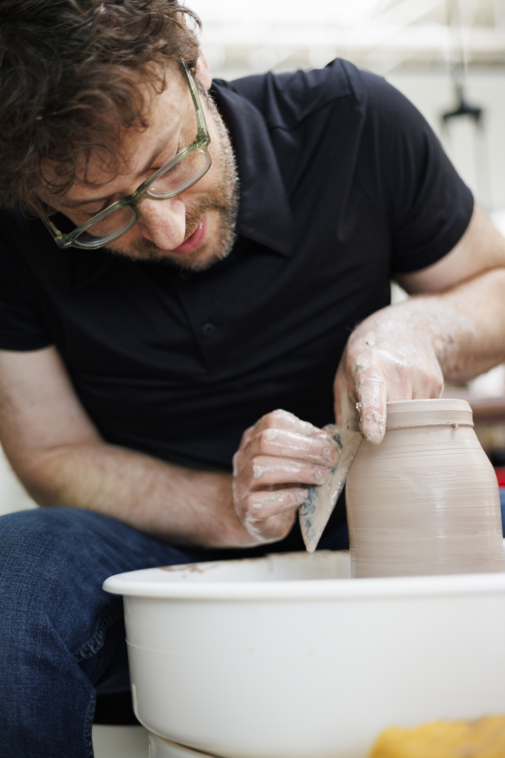 Gard demonstrates at the wheel using his chosen one tool – a throwing rib.